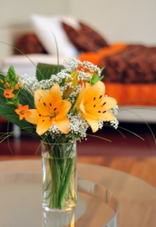 Beautiful Lilies in a vased flower arrangement.  Send flowers in Airdrie Alberta.